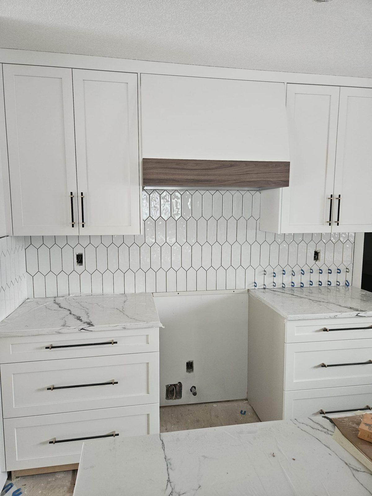 White shaker kitchen with patterned backsplash, Calgary renovation